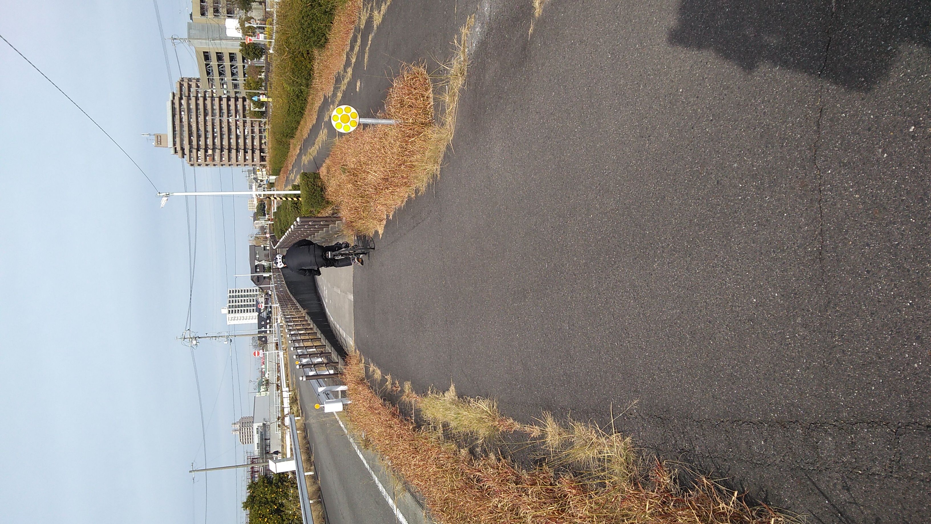 A bicycle-path underpass dipping under a road.